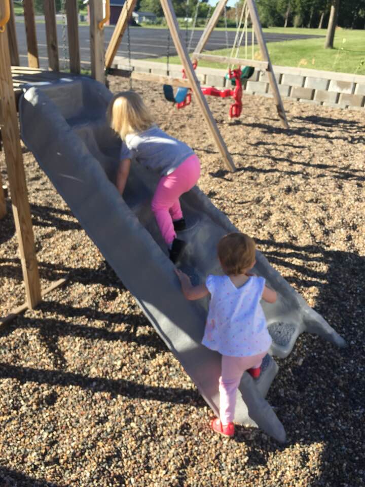 Foster Care Stereotypes - 2 children climbing a slide