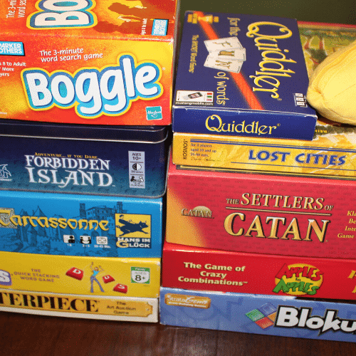 a stack of family board games