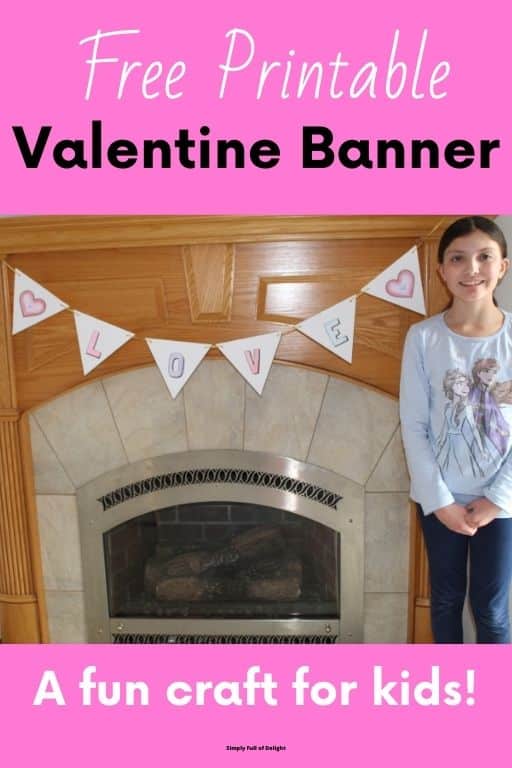 Free Printable Valentine Banner, a fun craft for kids!  - pic of child with completed banner