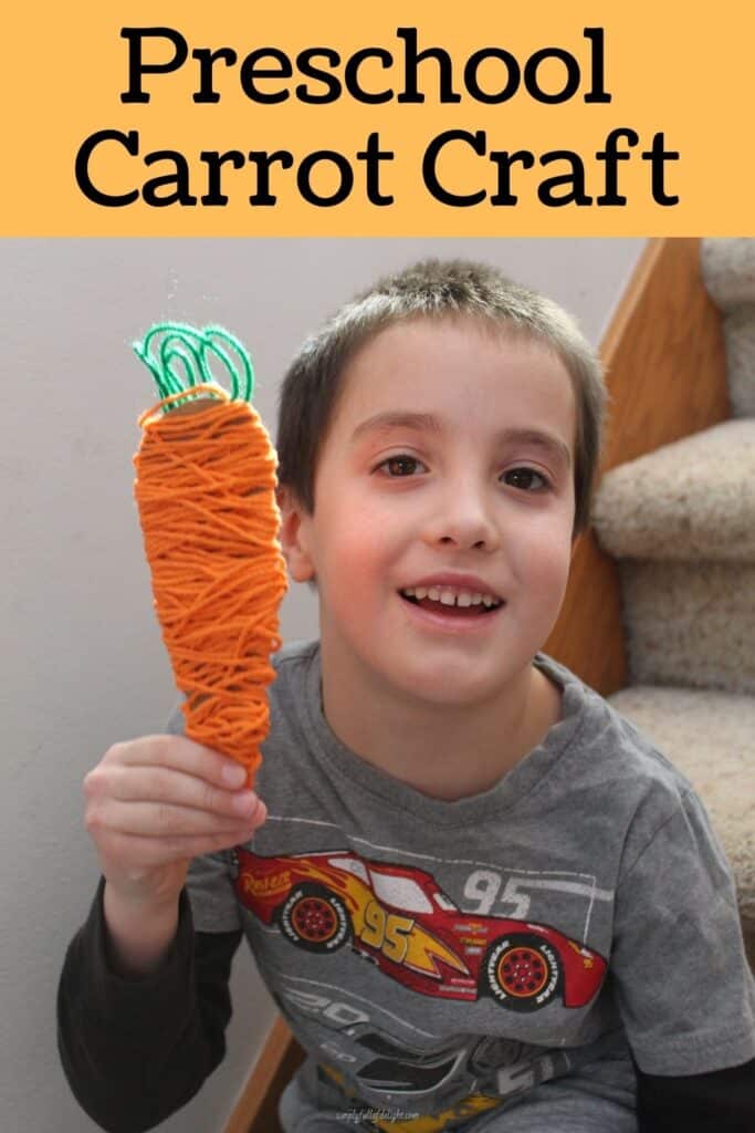 Preschool Carrot Craft - my son holding a carrot craft