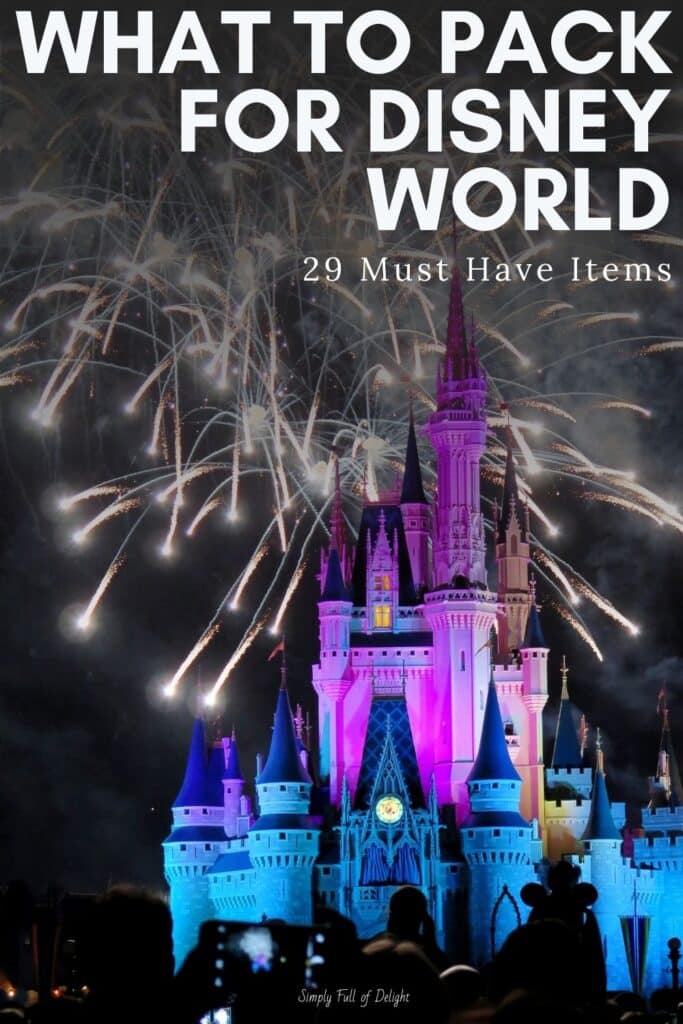 What to Pack for Disney World - 29 Must Have Items - shown: disney castle with fireworks