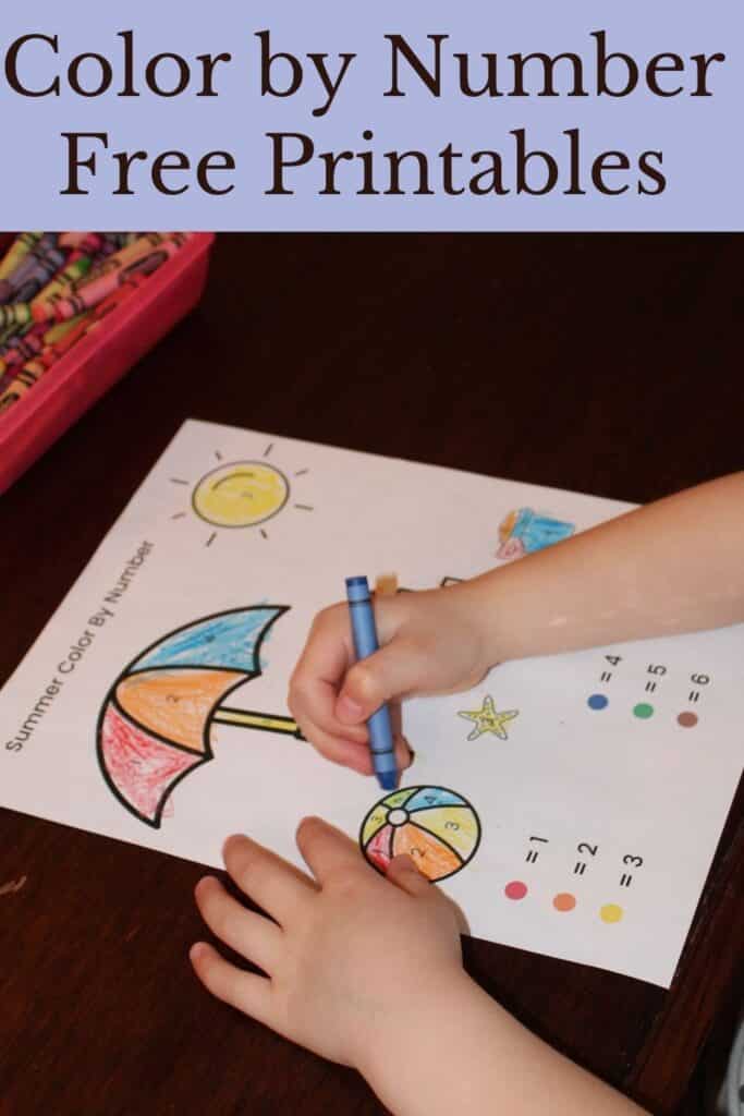 Color by Number Free printables, child coloring a beach scene color by number page