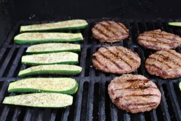 zucchini on the grill, seasoning side up first.