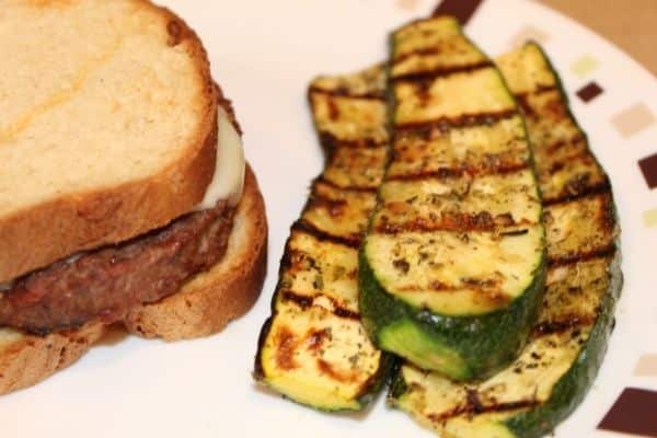 Grilled zucchini with a patty melt sandwich