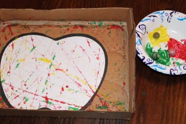 apple craft in a box with paint and marbles