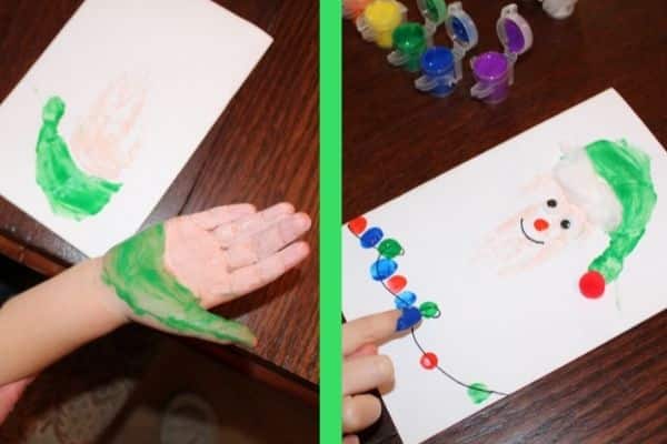 Elf Handprint cards - child's hand is painted with green on thumb and lower part of hand is also painted green, beige is painted on the rest of the hand and 4 fingers.