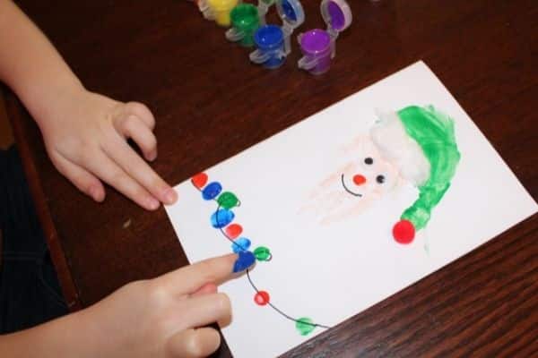 Making fingerprint Christmas lights on the Handprint Elf Christmas Card