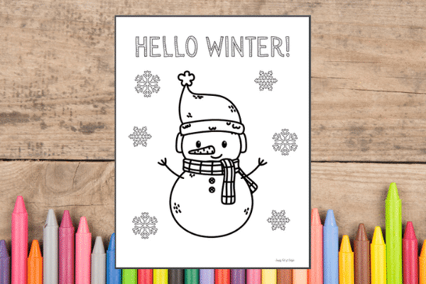Free Snowman Coloring Page printable shown with a background of crayons.   Free printable winter coloring page.
