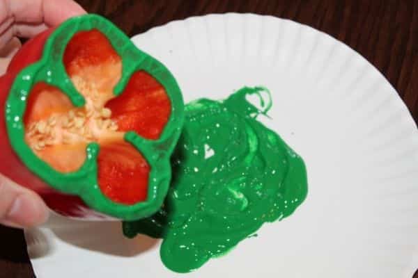 Bell Pepper Shamrock Painting craft for St. Patrick's day - shown: A red bell pepper, cut in half and dipped into green paint