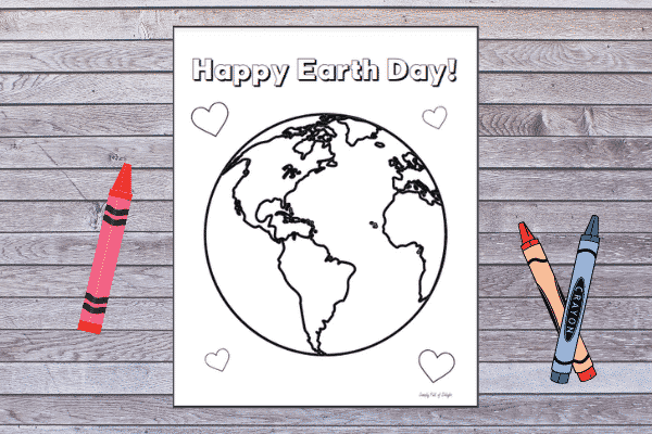 Happy Earth Day Coloring Page - Preschool Earth Coloring page shown on a wood background with crayons surrounding it