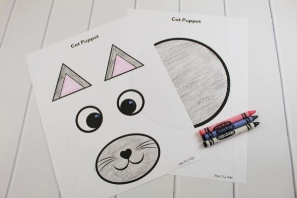 free cat puppet printable shown, colored with crayons