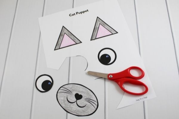 cat puppet template being cut out