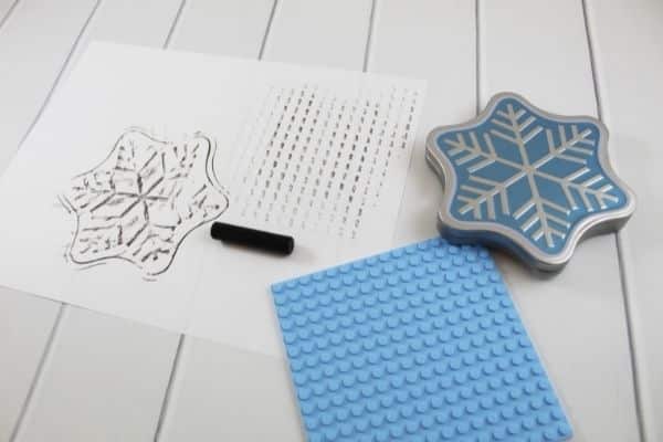 Texture rubbing activity for large group activity time for preschoolers - a texture rubbing shown with crayon, lego piece and snowflake container