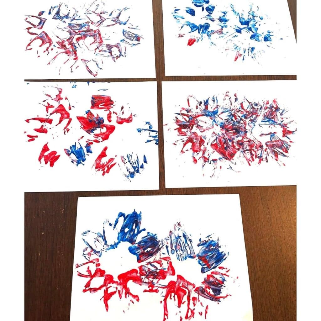 A collection of 4th of July fireworks crafts for toddlers and preschoolers - red and blue fireworks stamped onto a page with a pineapple dipped in paint.