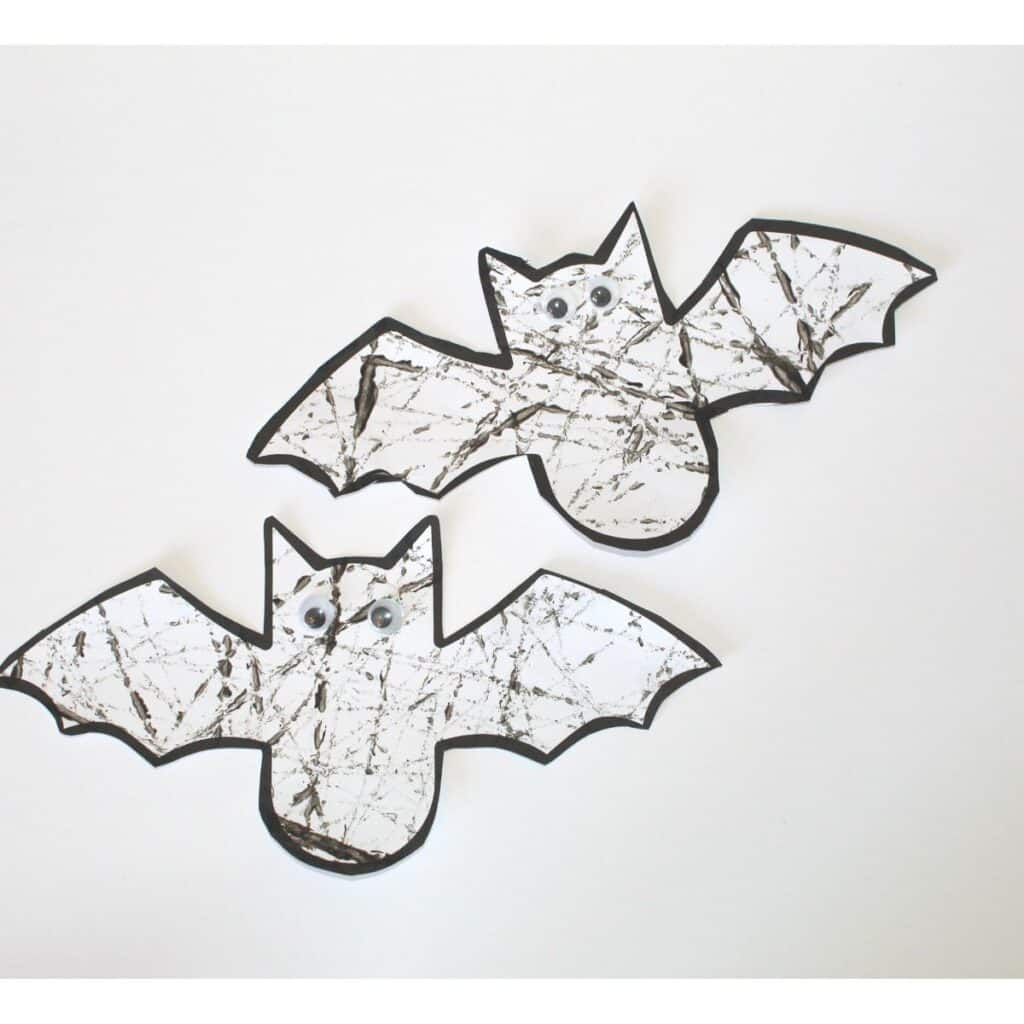 Easy preschool bat craft - free bat template is marble painted and googly eyes attached - it's finished!