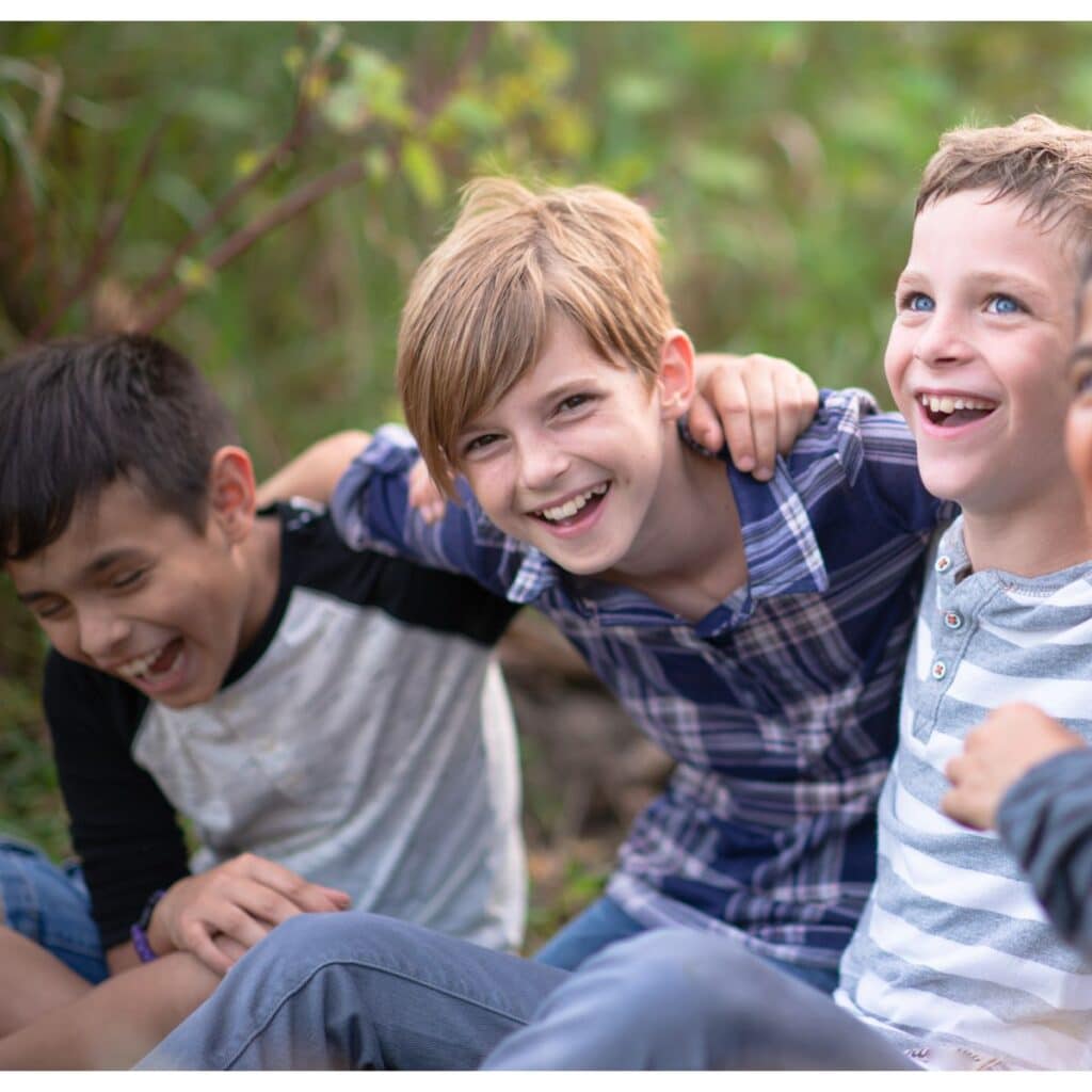 fun questions to ask kids - 3 tween boys laughing together