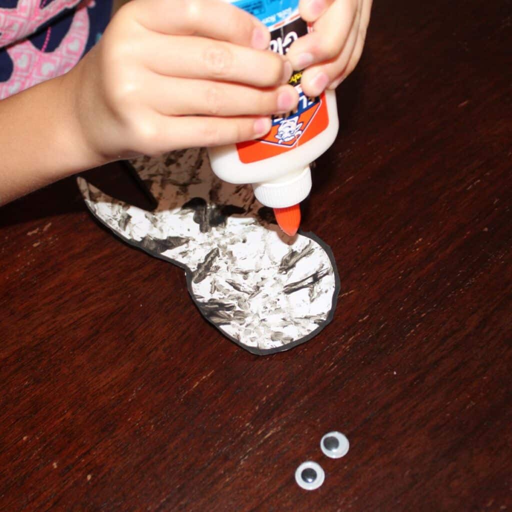 gluing eyes onto the mummy template