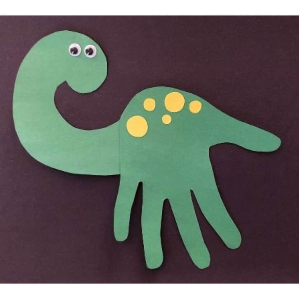 Dinosaur handprint craft by MomBrite