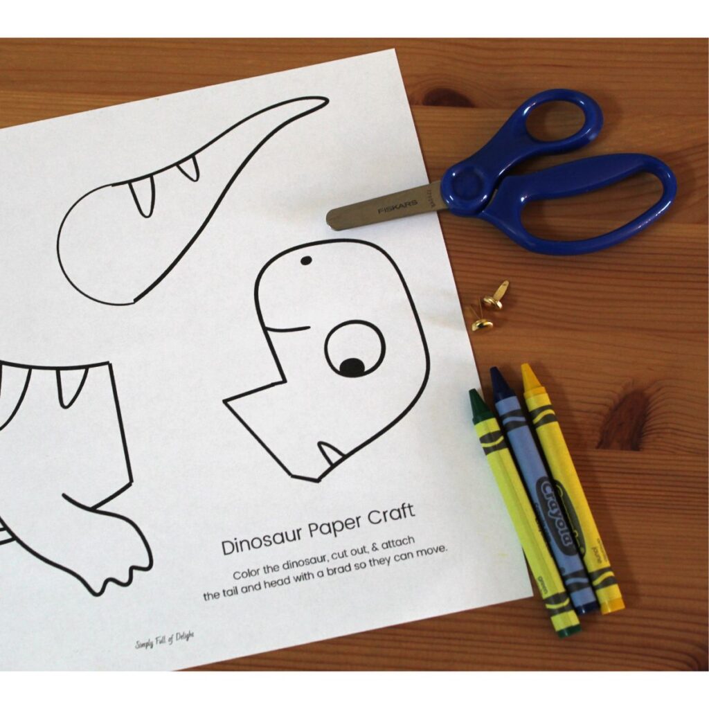 Easy dinosaur craft supplies including the free printable dinosaur template pdf, brads, scissors and crayons