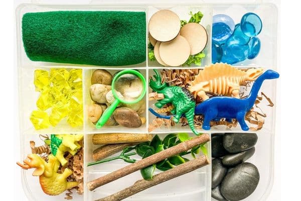 dinosaur sensory kit by Cool creations company - kit contains dinosaurs, rocks, gems, sticks and more!