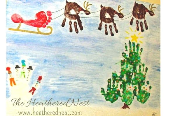 Handprint Christmas scene with santa, reindeer, snowmen and christmas tree by The Heathered Nest