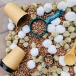 hot chocolate sensory bin - contains beans, pom poms, scoops and more!