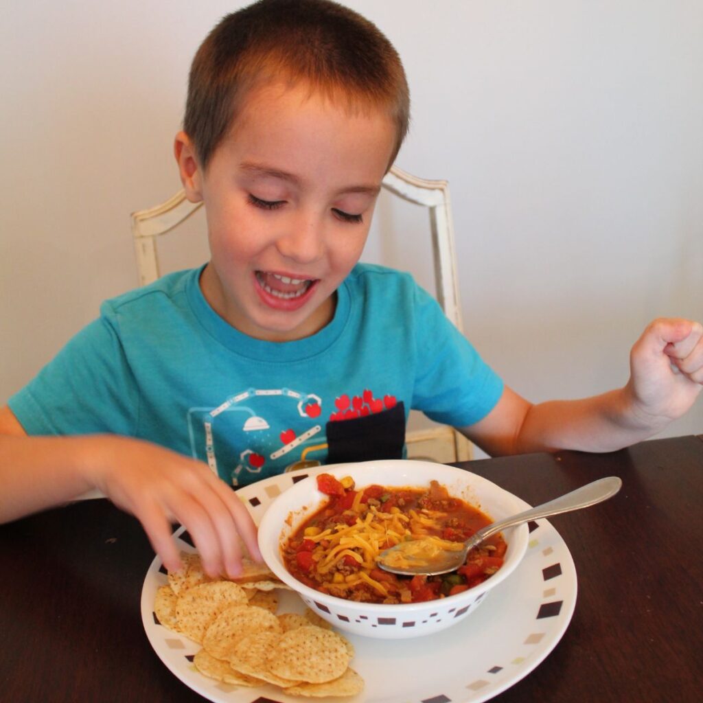 child shown eating kid friendly chili recipe