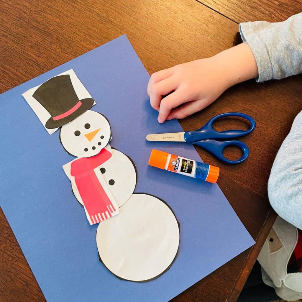 This cut out and build a snowman printable is perfect for preschool - little ones can make an easy snowman craft!
