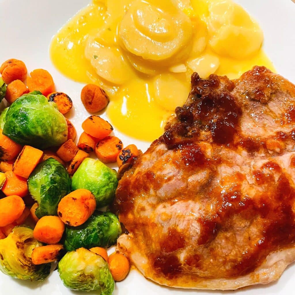 gluten free pork chops with au gratin potatoes and Brussel Sprouts and Carrot sauté 