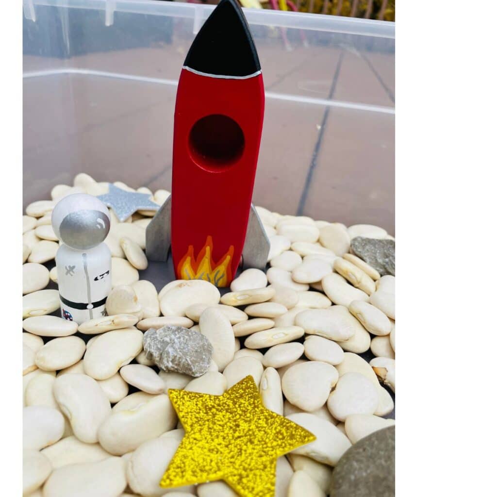 space sensory bin for preschoolers, an outer space sensory play idea