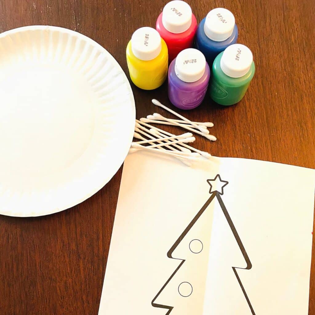 symmetry Christmas tree supplies - washable kid paint, q-tips, paper plate and the free printable Christmas tree template