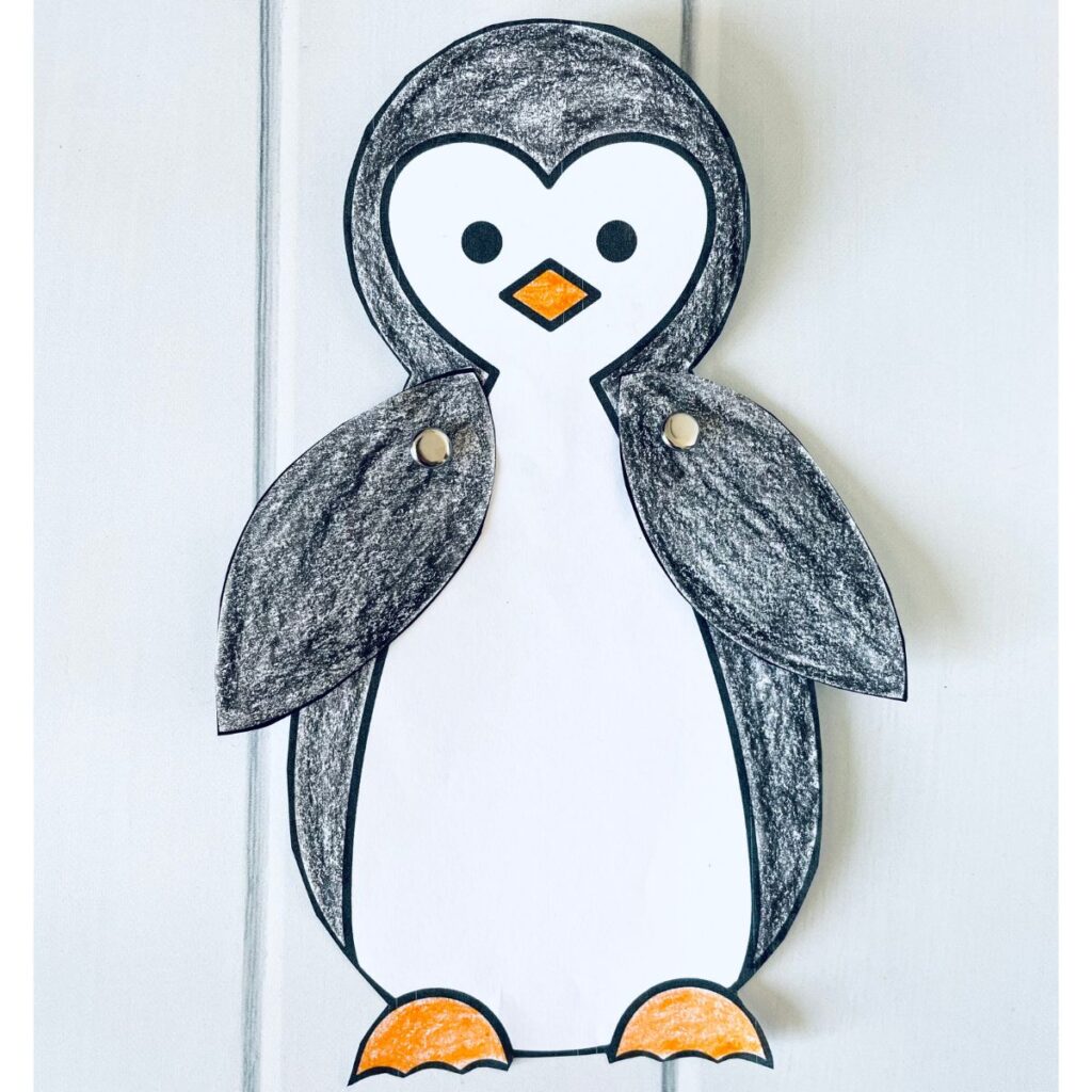 paper penguin craft completed with paper fasteners to make it a moveable penguin.