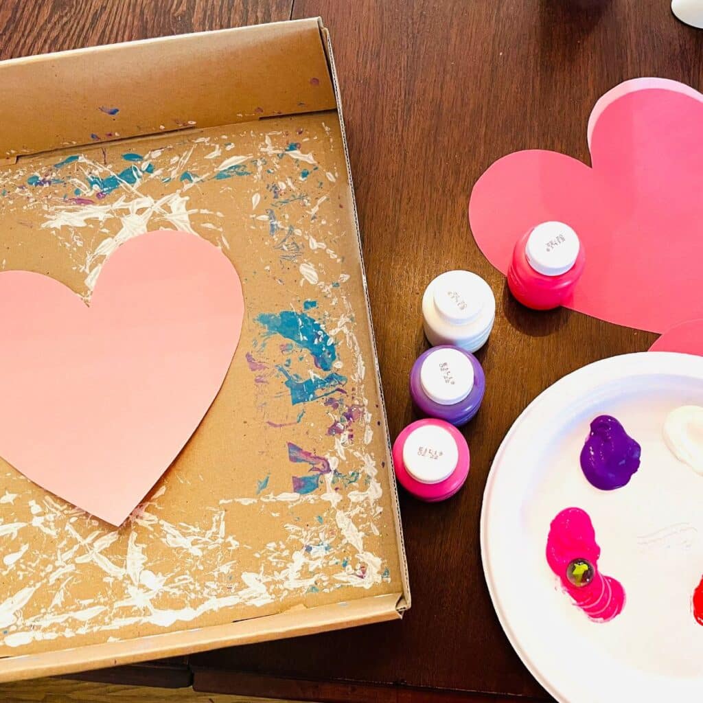 Valentine's Day heart paint with marbles activity