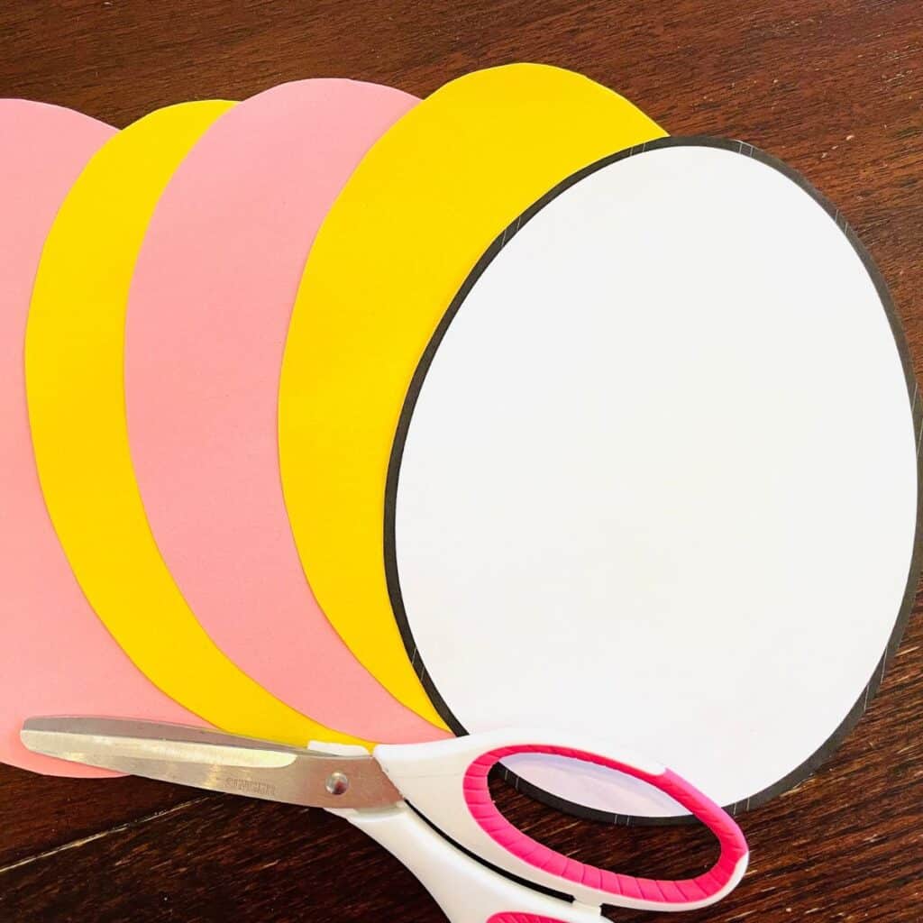 Easter egg template with pink and yellow paper egg copies