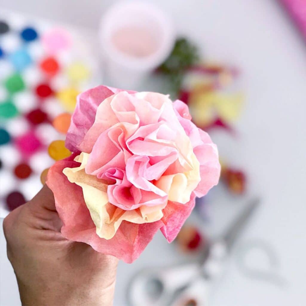 tissue paper flowers by The Country Chic Cottage - pink and yellow tissue paper flower shown