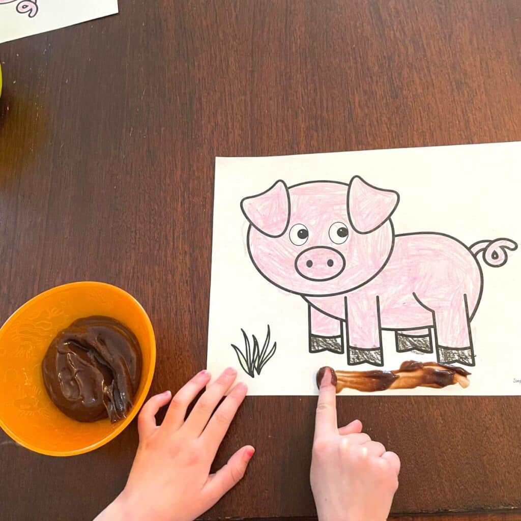 child painting pig template with chocolate pudding