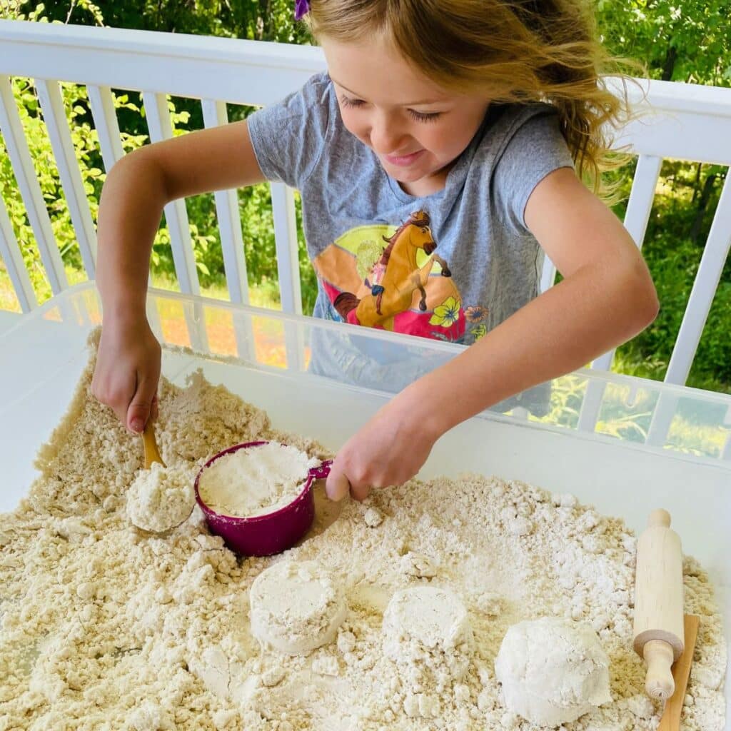 child playing with gluten free moon sand