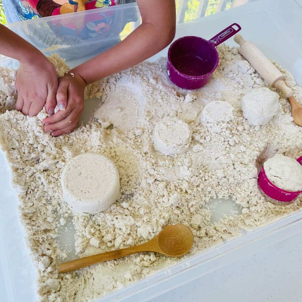 child playing in moon sand