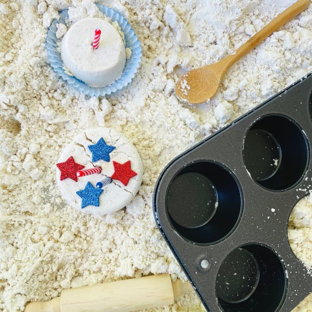 4th of july sensory bin with moon sand and cupcake making supplies for America's birthday