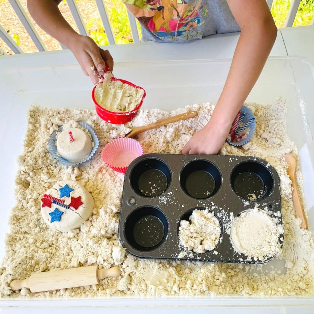 child making moon sand patriotic cupcakes