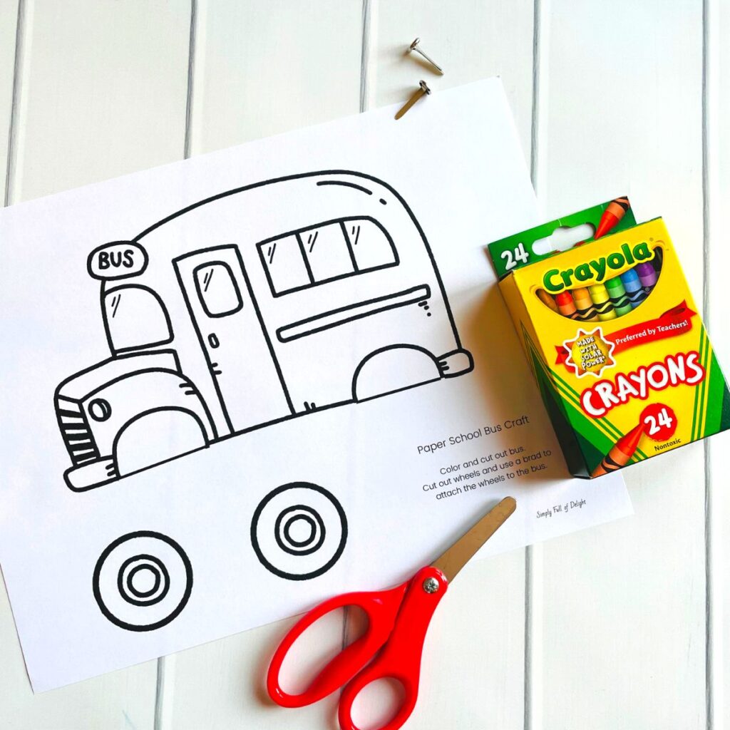 supplies for easy paper bus craft - free printable bus, 2 paper fasteners, crayons, and scissors