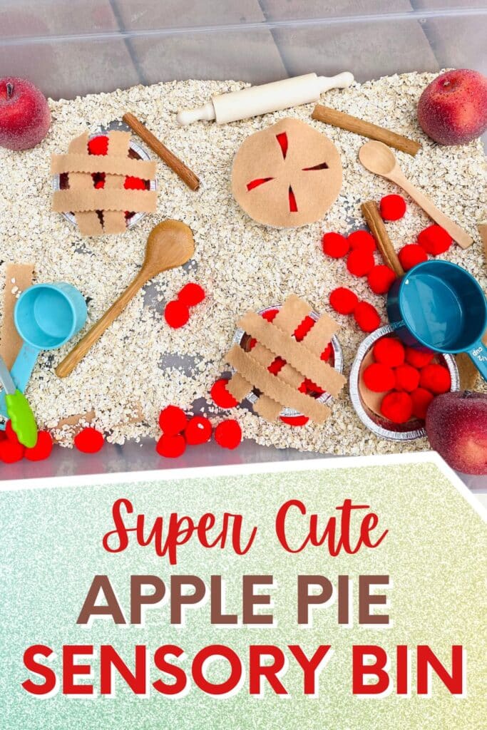 Super cute Apple Pie Sensory Bin - sensory bin filled with oats, red pom poms, fake apples, scoops, cinnamon sticks and rolling pins