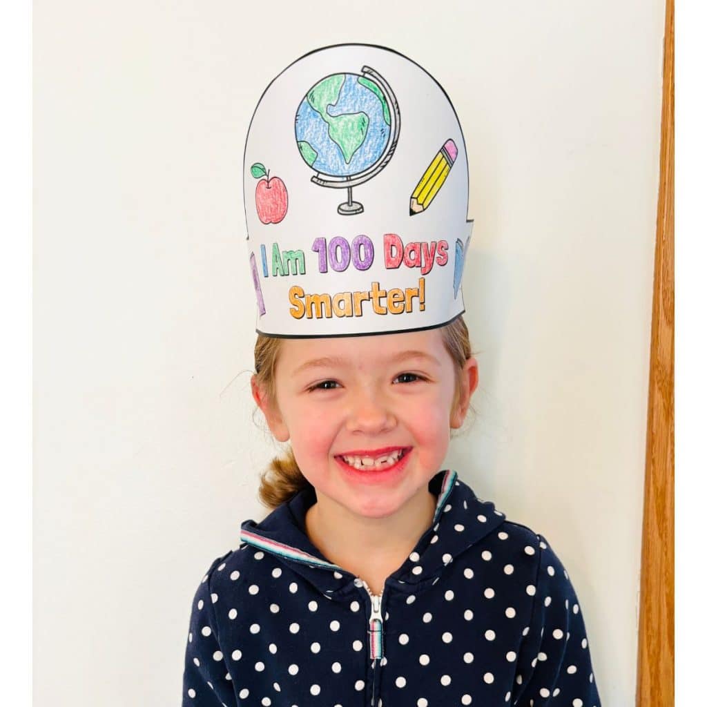 child wearing 100th Day of School hat craft