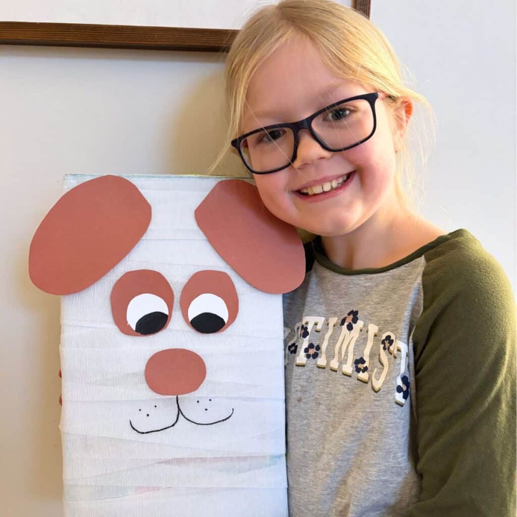 child holding dog valentine box