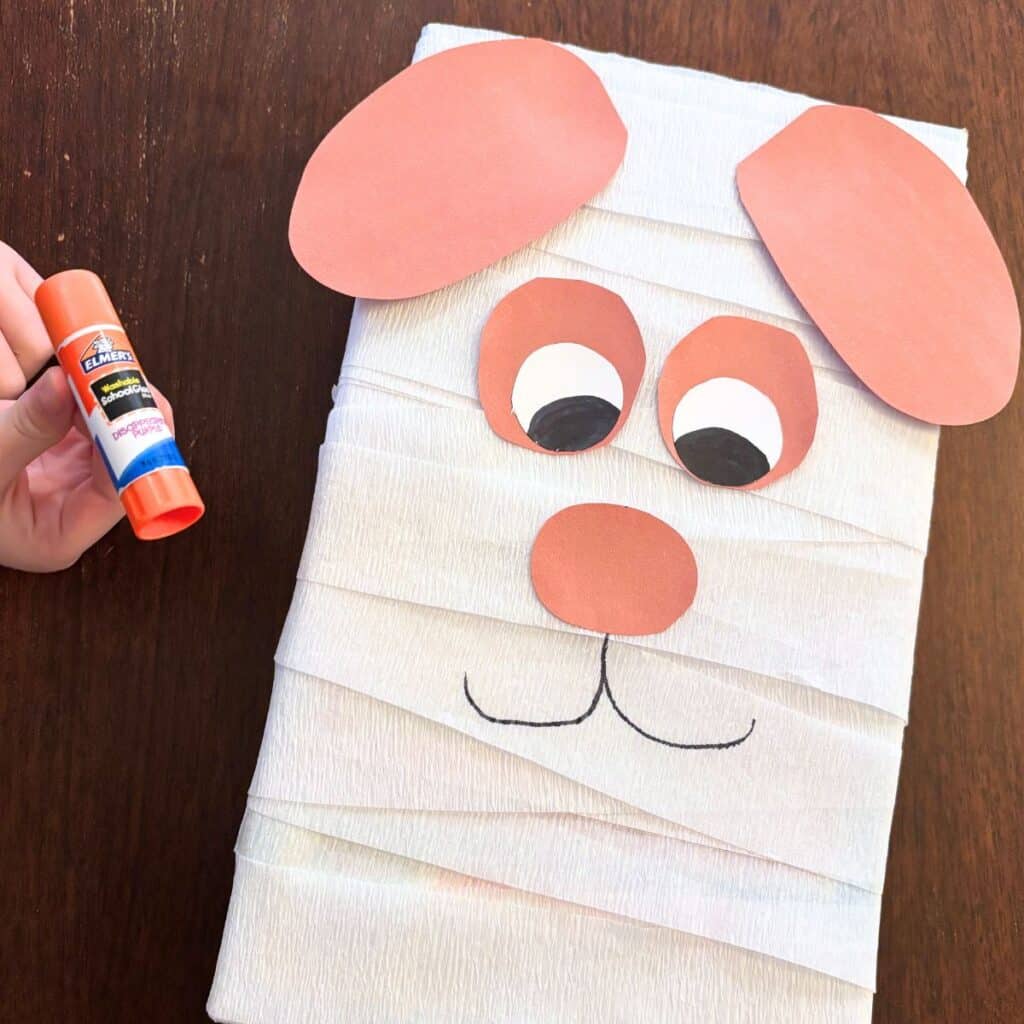 glue stick to attach pieces and draw face with marker