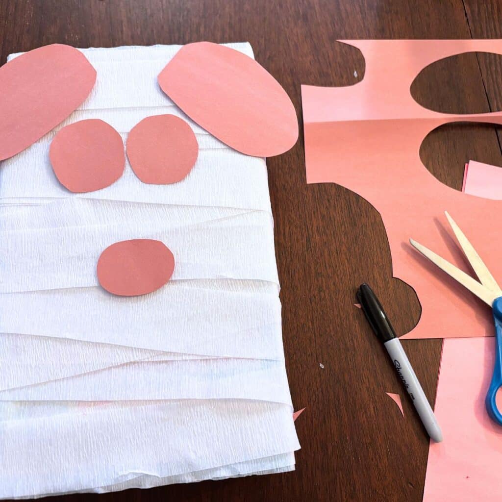 cutting out the eye patches, ears and nose