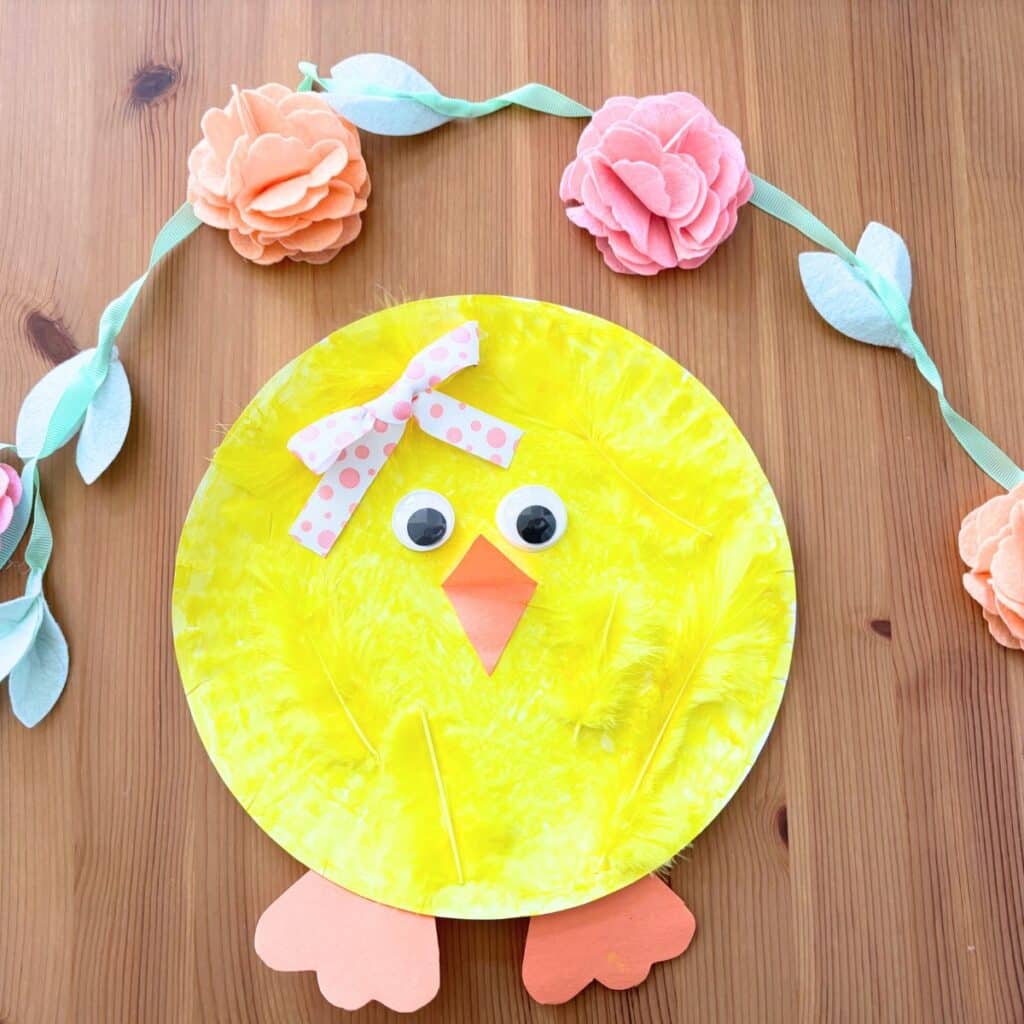 a girl paper plate chick craft with a hairbow