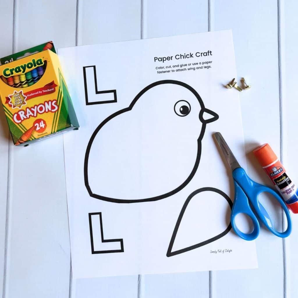 supplies for chick craft - crayons, chick template, scissors, glue stick, paper fasteners