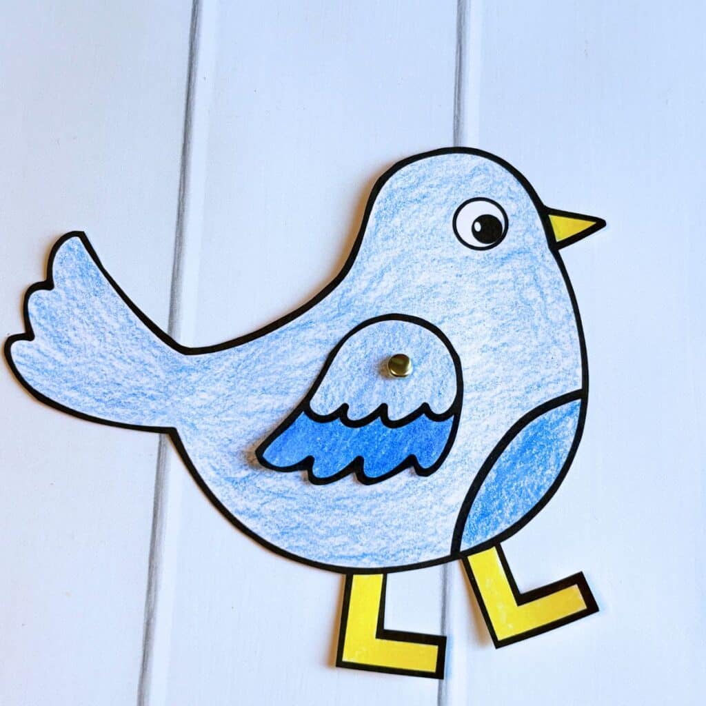 paper fastener attaching bird wing
