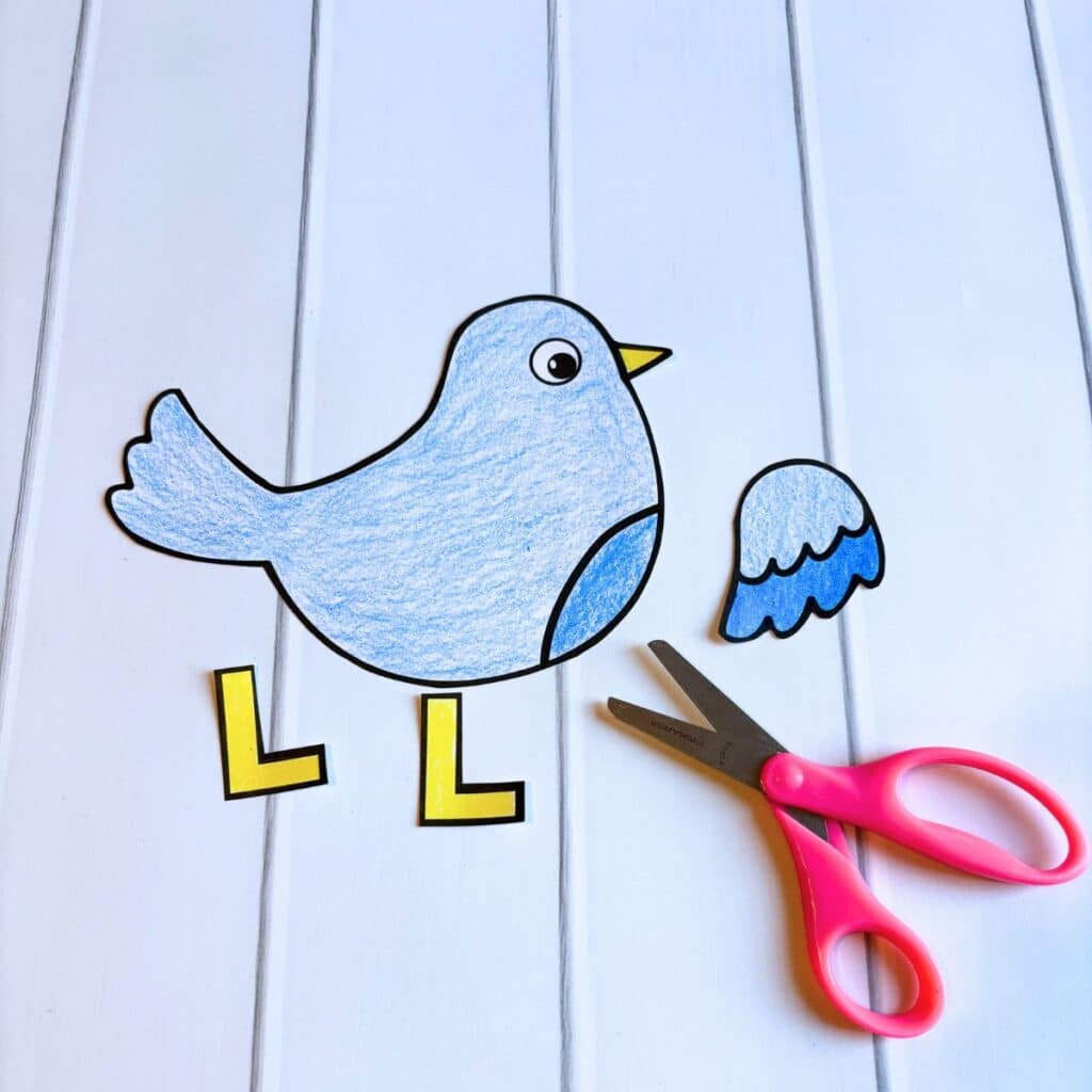 paper bird cut out with scissors